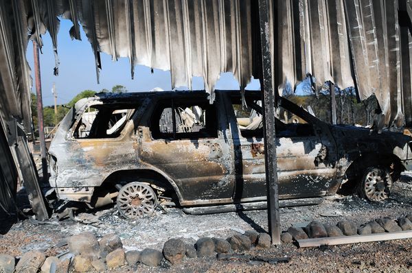 26.) Charred SUV in the wake of a wildfire.