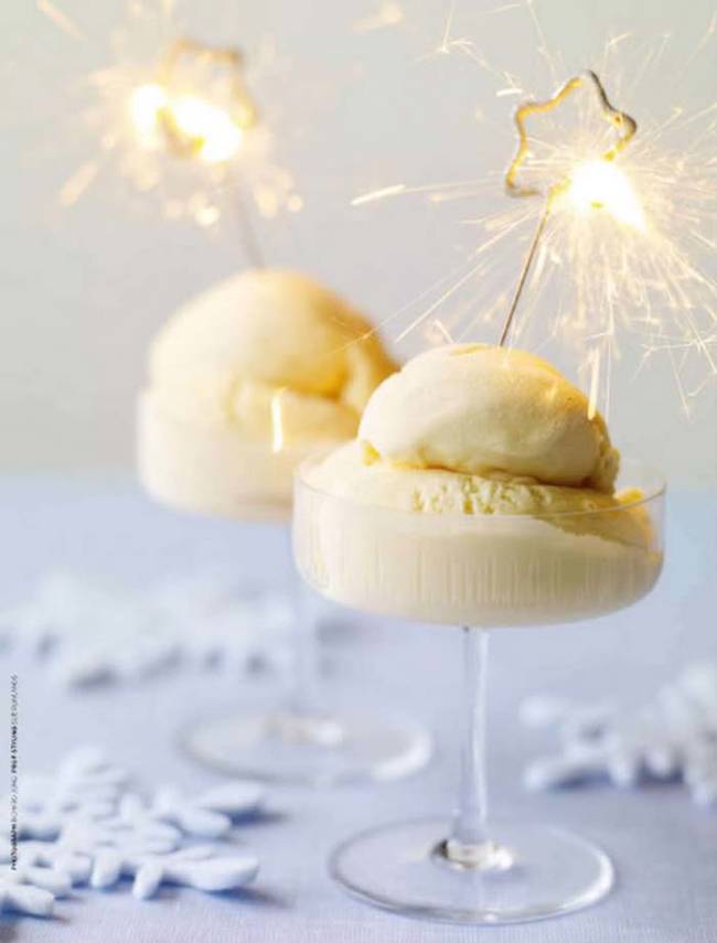 13.) For a non-alcoholic treat, serve <a href="https://www.everythingfab.com/2010/12/holiday-inspiration-sparkling-dessert.html" target="_blank">ice cream in a stemmed glass</a> with a sparkler on top.