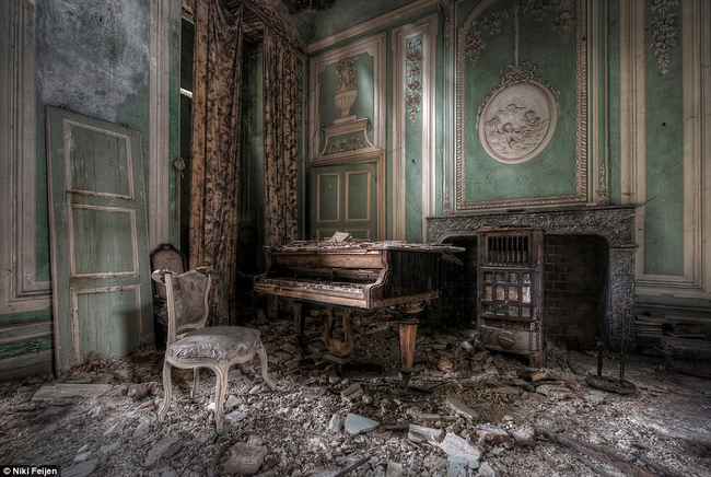 Despite the crumbled ceiling, the former opulence of this room remains visible.