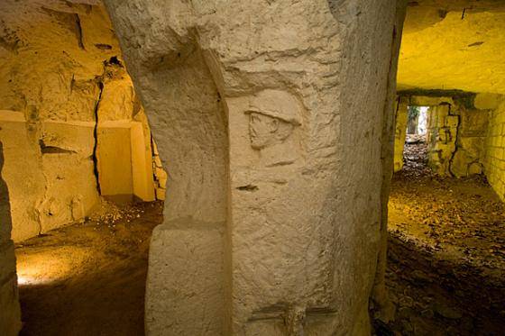 A Benedictine monastery occupied by French troops, as evidenced by the carvings left in the walls.