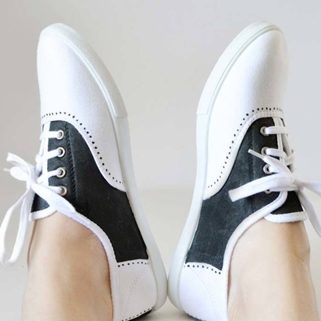 A pair of white lace-ups become vintage saddle shoes with a black permanent marker.