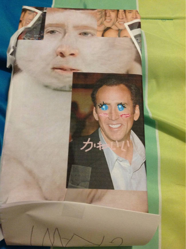 Wha? What's scary Nicolas Cage doing on this present? What's in the box!?