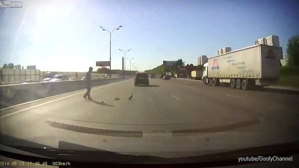 This man who braved highway traffic for this small family.