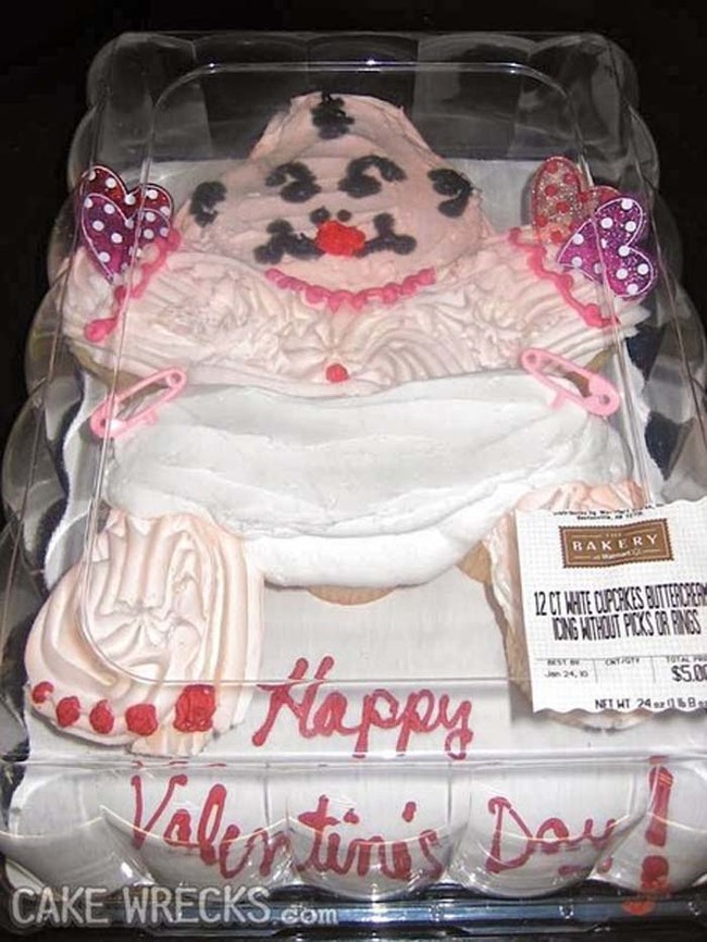 This is either a poorly iced baby cake, or a perfect cake portrait of the world's ugliest baby.