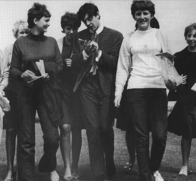 In this photo, the website would like to point out that the girls in this picture are not wearing heels, but McCartney is. Clearly he must be a clone.