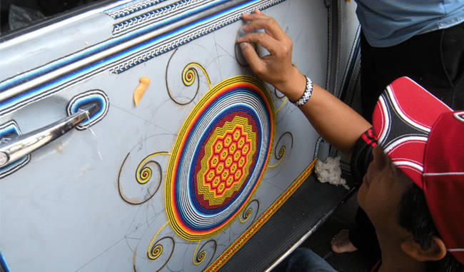 This 1990 Volkswagen Beetle received over 2 million glass beads along with beeswax to cover every inch of the car’s exterior and the dashboard.