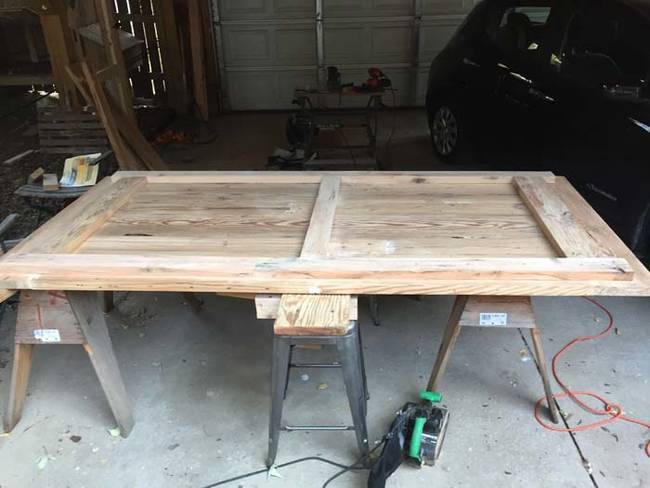 The wood was arranged into a frame before sanding and staining.