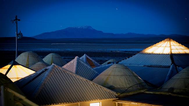 The Palacio de Sal is located on Bolivia's Salar de Uyuni, the world's largest salt desert. The salty sand itself was used to create this 48,000 square foot hotel, after being pressed into bricks, as seen above the bed in the top picture. The hotel is about $135 a night, and features a golf course and spa treatments.