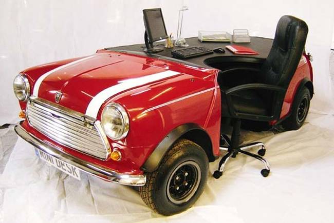 14.) Add some fuel to your work day - this desk is made from a Mini Cooper.