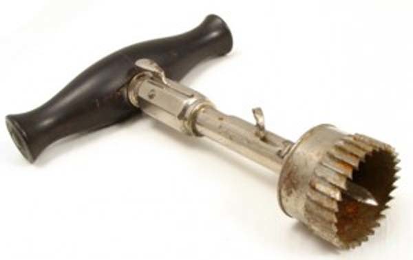 19.) Trephine (1800s): The trephine basically was a hand-powered drill with a cylindrical blade, used to bore into the skull. The spike in the center would hold the instrument still while cutting.