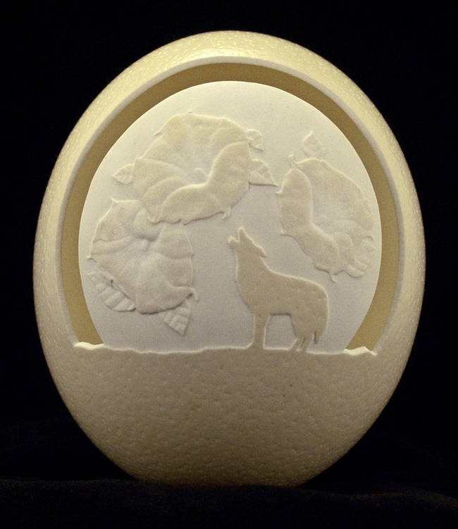 Another of eggdoodler's ostrich egg pieces, this one with a more substantial, but no less detailed, form.