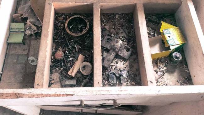 Looking inside the kitchen drawers.