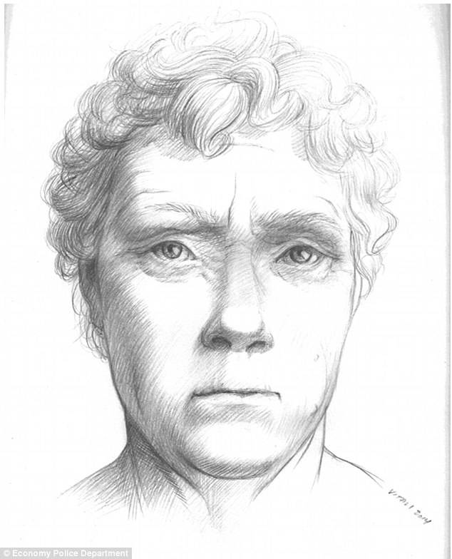 The woman appears to be a white woman, 50 years of age or older. Her hair is whitish gray and is curly.