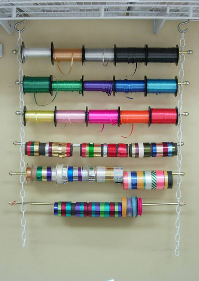 26.) Organize ribbon or wrapping paper with curtain rods and chains.