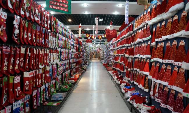 At the market, there are halls and halls of extremely specific Christmas goodies. This includes a whole row of Santa hats.