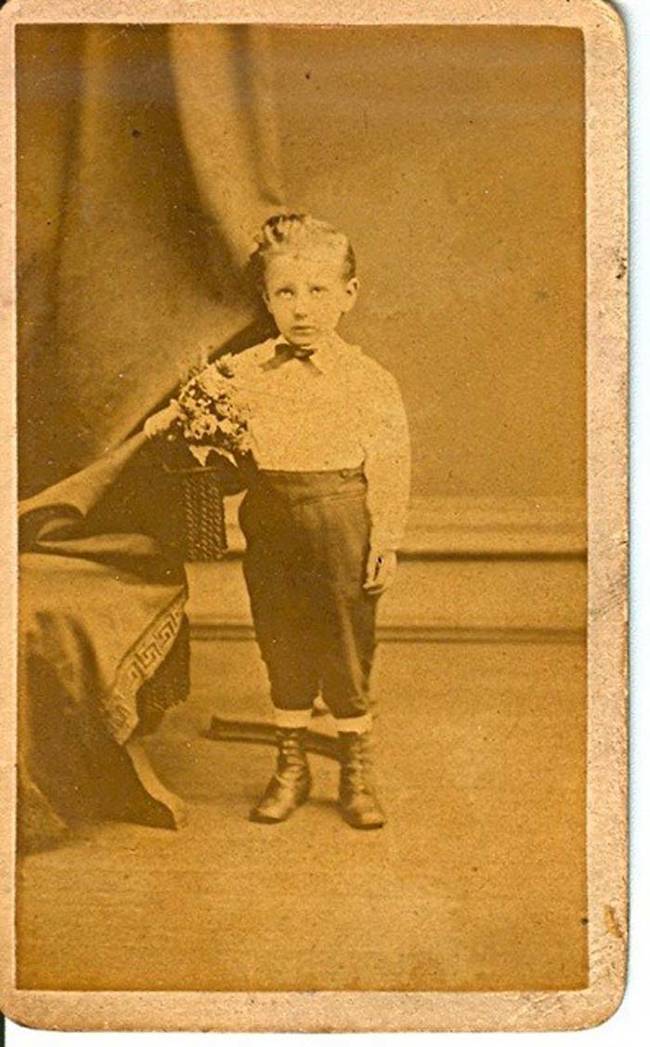 9.) Notice the odd position of the curtain behind the boy? It's likely there was someone behind it holding the boy's head up.