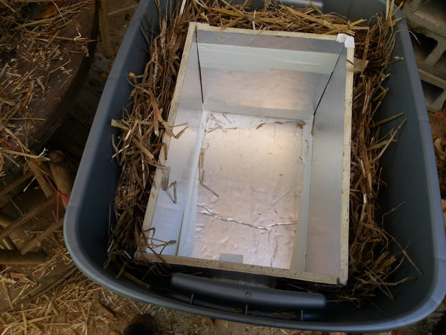 Tape the walls together and add more straw around that, creating a cozy box.