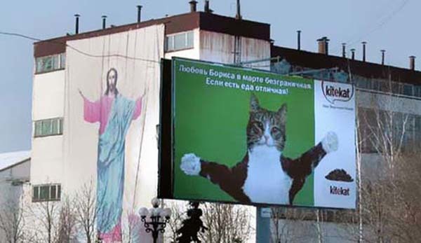 13.) Ah yes. The welcoming arms of Jesus... and his cat.