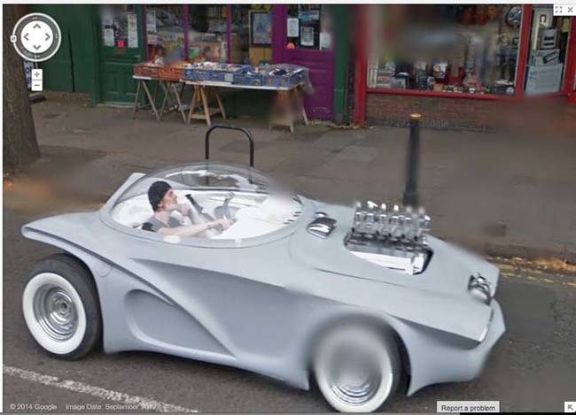 This strange yet cool fellow contemplating life in a car from the future.