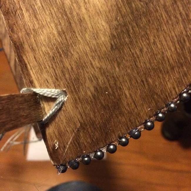 Using hot glue, she attached the beads.