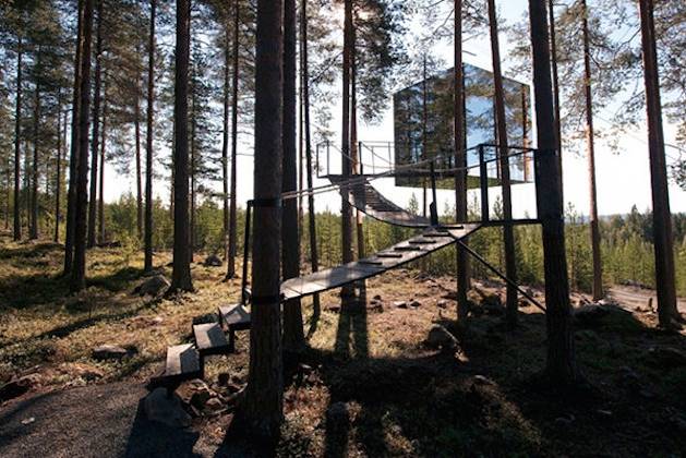 I can't believe this one. That's right, that's a tree house covered in mirrors called The Mirrorcube. That's one way to blend-in with the environment.