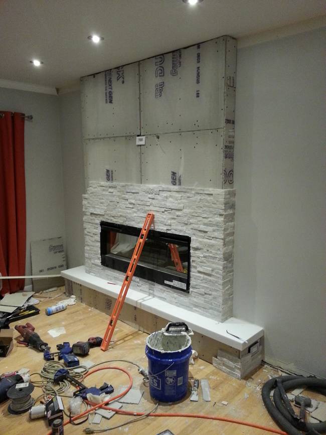 Everything started coming together when they added beautiful white-gray stones to the hearth.