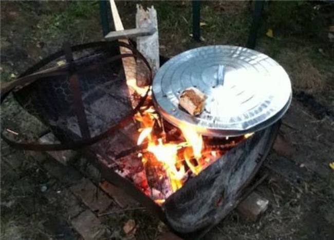 Mmmmm...trash can lid BBQ.