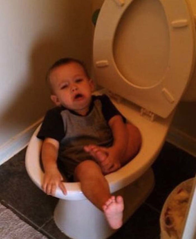 1.) This little guy not using the big boy toilet correctly.