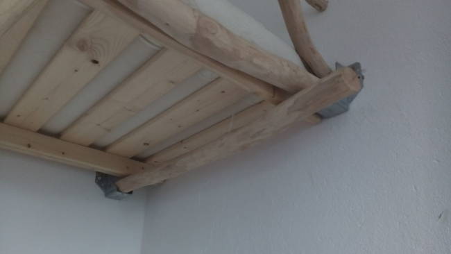 Metal braces were also used to hold the bed frame in place against the walls.