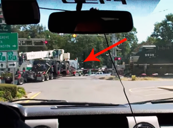 Train Crashes Into A Broken Down Tractor Trailer Carrying A Crane.