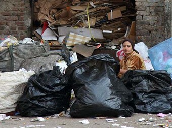 This Egyptian Neighborhood Is Buried In Trash, But That’s Not The Most Shocking Part