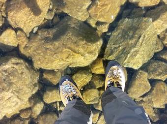 These Hikers Came Across Beautifully Clear Ice On A Frozen Lake In The Mountains