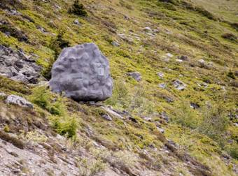 This May Just Look Like An Ordinary Boulder, But It’s Really A Cabin