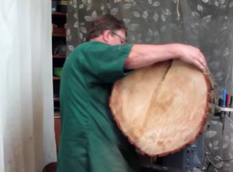 A Guy Drags A Tree Trunk Inside And Transforms It Into A Lamp Shade