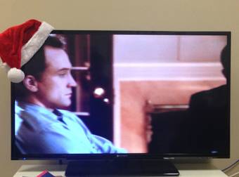 Putting A Santa Hat On The Corner Of A TV Is The Best New Christmas Tradition